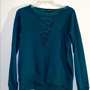 blue fleece long sleeve with gold neck cut out